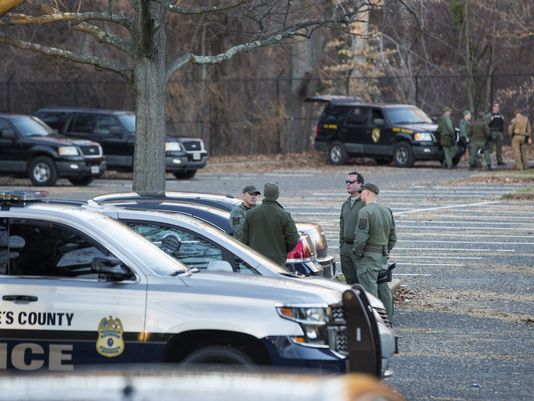 Law enforcement officers from Baltimore and outside jurisdictions use a staging area in north Baltimore's Druid Hill Park while awaiting a verdict in the trial of Officer William Porter