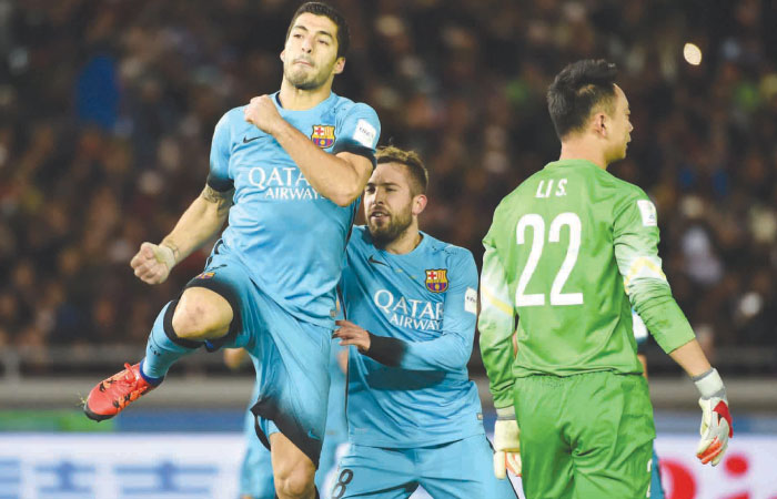 Barcelona forward Luis Suarez celebrates his goal against Guangzhou Evergrande during their Club World Cup semifinal match in Yokohama Thursday. — AFP