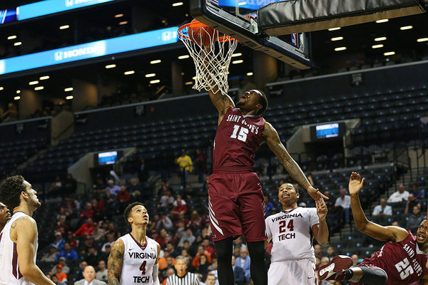 Saint Joseph´s Hawks forward Isaiah Miles dunks during the first half against the Virginia Tech Hokies at Barclays Center