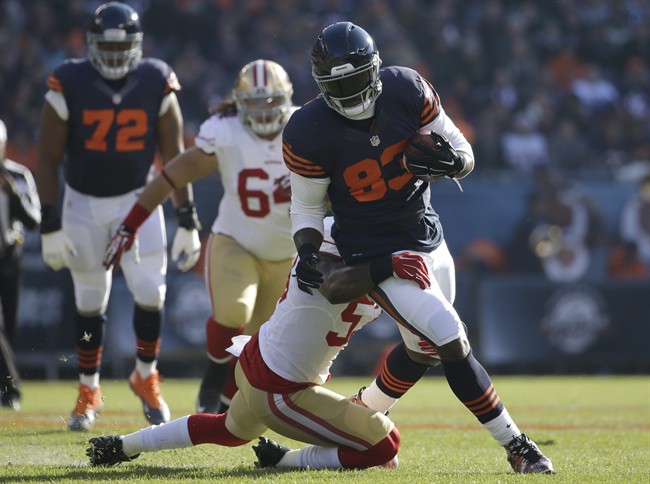 Chicago Bears tight end Martellus Bennett is tackled by San Francisco 49ers inside linebacker Na Vorro Bowman during the first half of an NFL football game Sunday Dec. 6 2015 in Chicago