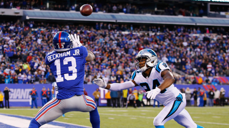 Beckham scores a game-tying touchdown against the Panthers as Norman looks