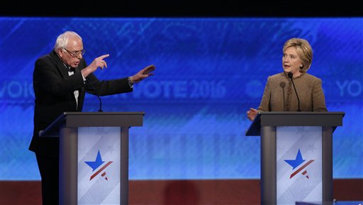 Bernie Sanders left and Hillary Clinton speak during an exchange during the Democratic presidential primary debate Saturday Dec. 19 2015 at Saint Anselm College in Manchester N.H