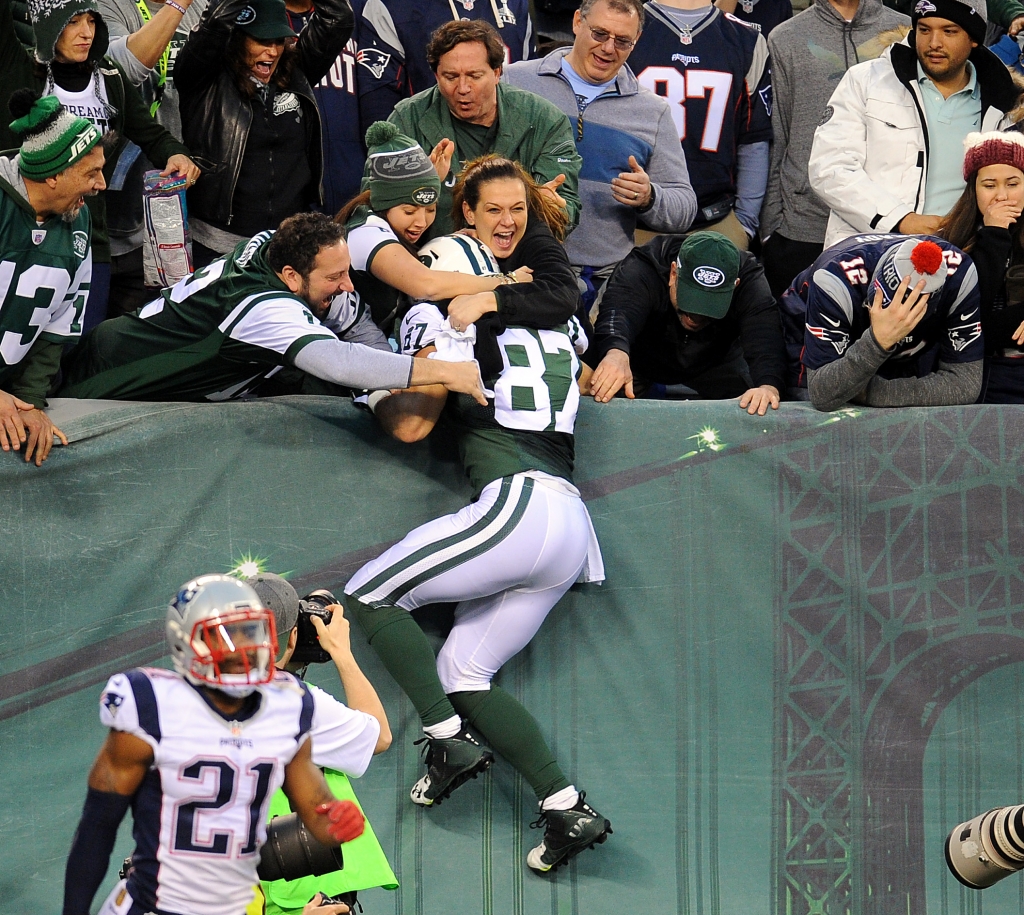 12/27/15 new england patriots vs  ny jet at metlife stadium east rutherford nj New York Jets win 26-20 New York Jets wide receiver Eric Decker #87 leaps into the arms of New York Jets fans as he catches the winning td in