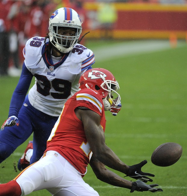 Kansas City Chiefs wide receiver Jeremy Maclin right makes a catch ahead of Buffalo Bills cornerback Mario Butler during the first half of an NFL football game in Kansas City Mo. Sunday Nov. 29 2015