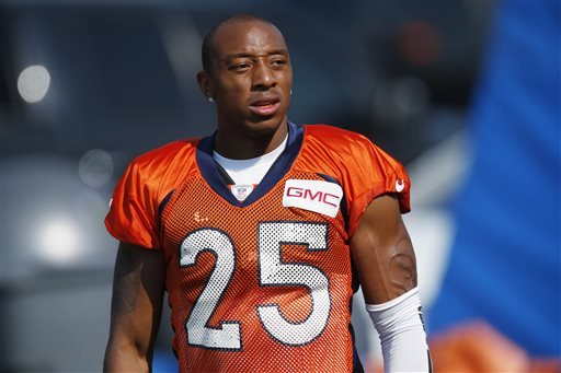 Denver Broncos cornerback Chris Harris takes a break during drills at the team's NFL football training camp session in Englewood Colo. Denver's defense is ranked first in stopping both the passing and