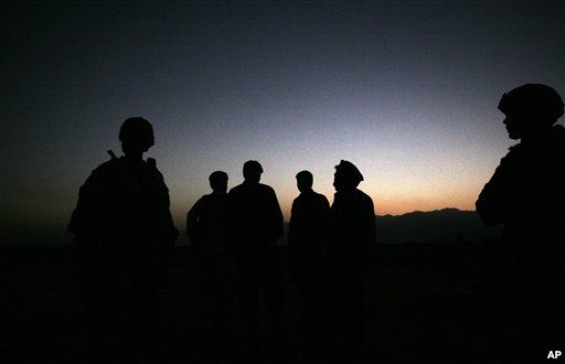 U.S. Army soldiers stand with Afghan policemen before a joint patrol of Qalanderkhail outside of Bagram Air Field in Afghanistan. On Monday December 21 a suicide bomber killed six U.S. troops in an attack on a