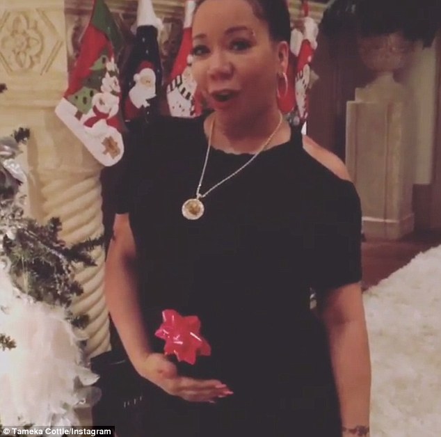 Bun in the oven! Tameka'Tiny Cottle revealed that she was pregnant with her rapper husband T.I.'s seventh child in a Christmas Day video