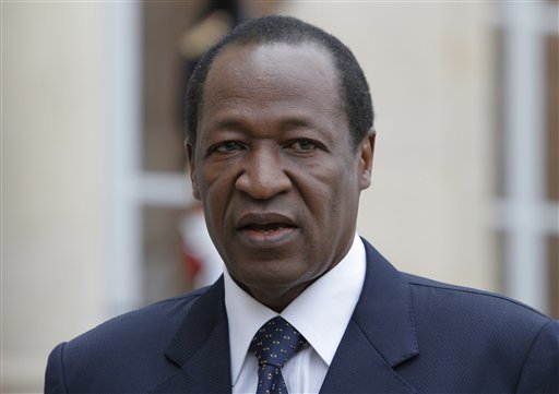 Burkina Faso's president Blaise Compaore speaks to the media after a meeting with France's President Francois Hollande in Paris. Burkina Faso's military court has issued an international arrest warrant