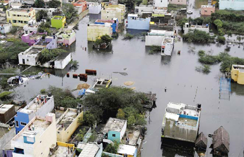 CHENNAI A residential area is seen surrounded by floodwaters yesterday. — AP