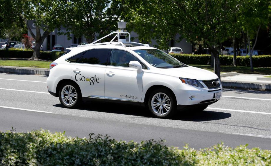 A Google self-driving car goes on a test drive near the Computer History Museum in Mountain View Calif. California unveiled precedent-setting draft rules Wednesday that would slow the public’s access to self-driving cars of the future until regulators