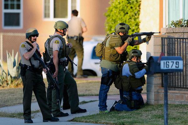 Police officers conduct a manhunt after a mass shooting in San Bernardino California on Dec. 2 2015. A couple described as husband and wife dropped off their 6-month-old baby at a relative´s house before storming a holiday party killing 14 and inju