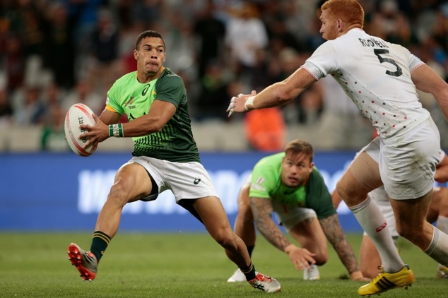 South Africa's Cheslin Kolbe runs with the ball during the second round of the World Series Sevens rugby match at the Cape Town stadium in Cape Town on D