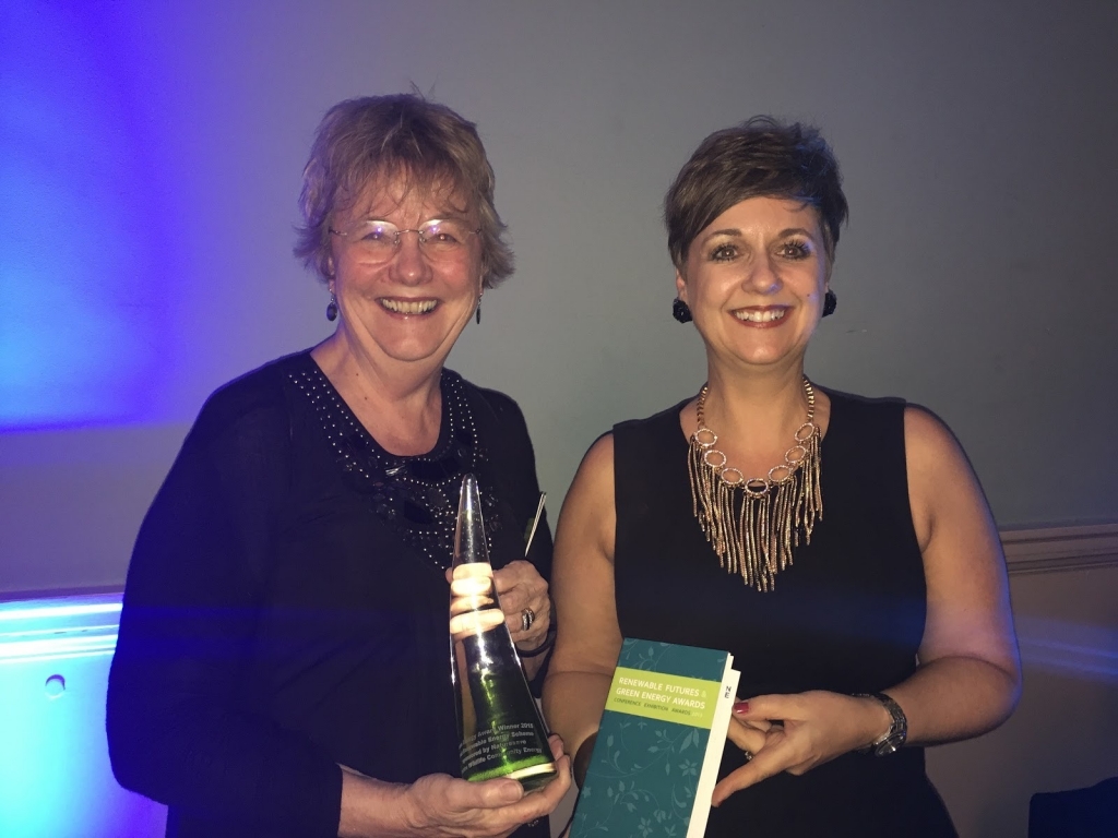 This Is Wiltshire Lesley Bennett and Emma Chapman collect the Best Renewable Energy Scheme Award for the Wiltshire Wildlife Community Energy at Renewable Futures and Green Energy Awards