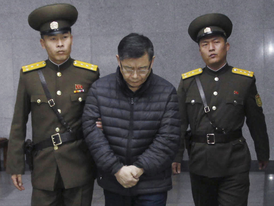 Hyeon Soo Lim centre who pastors the Light Korean Presbyterian Church in Toronto is escorted to his sentencing in Pyongyang North Korea Wednesday Dec. 16 2015