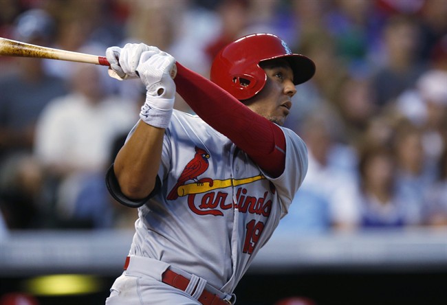 St. Louis Cardinals Jon Jay follows the flight of his solo home run off Colorado Rockies starting pitcher David Hale in the sixth inning of a baseball in Denver. The Cardinals have acquired infielder Jedd Gyorko