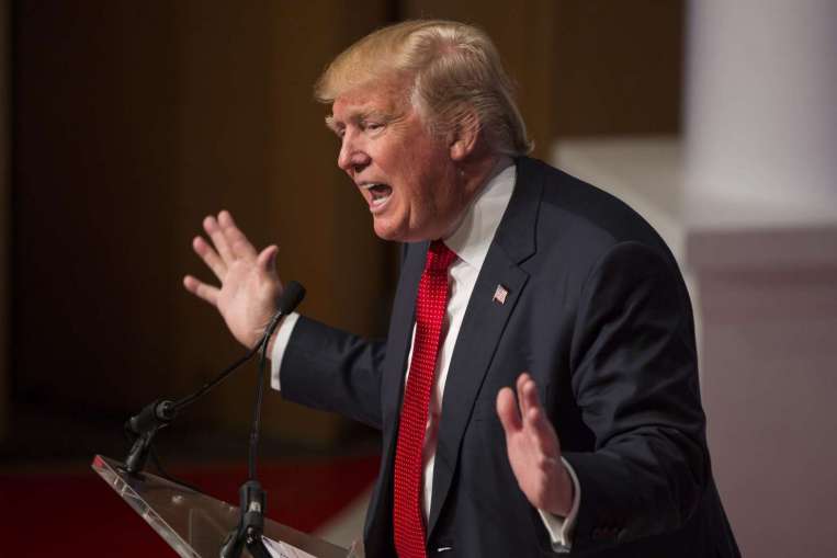 Trump rejects criticism of his proposal to ban Muslims