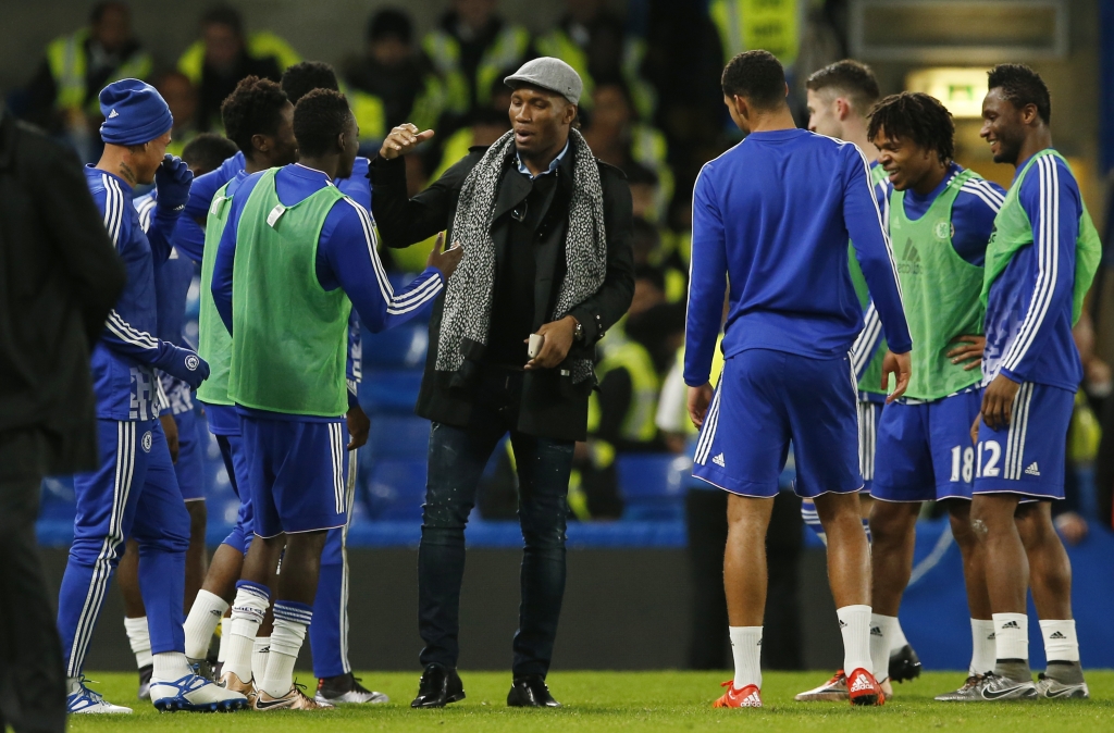 Didier Drogba with Chelsea players on the pitch after the game at Stamford Bridge