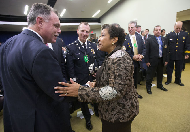 Attorney General Loretta Lynch greets Chicago Police Superintendent Garry Mc Carthy in the Old Executive Office Building on the White House complex in Washington. Chicago Mayor Rahm Emanuel has fired Mc Carthy after