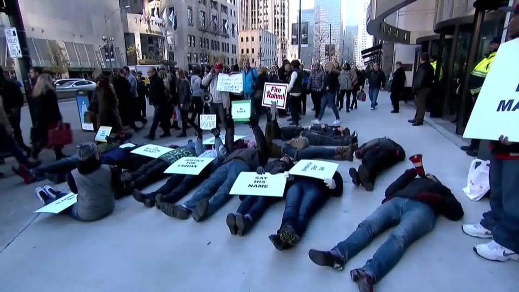 Demonstrators staged a'die-in in downtown Chicago in protest of the fatal shooting of a black teen by a white police officer