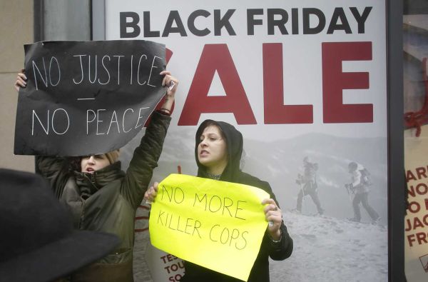 Demonstrators protest the shooting of Laquan Mc Donald along