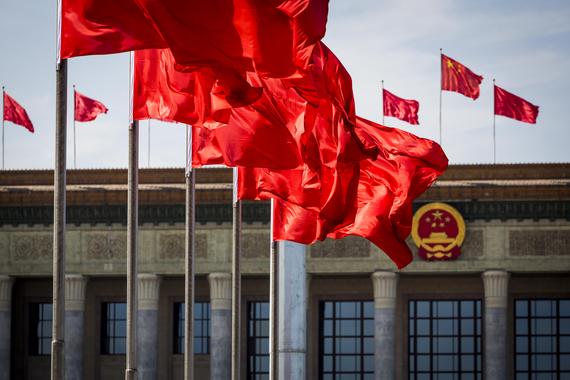 China's Great Hall of the People is decked in red flags ahead of an assembly of the country's legislature.               Zhan Min- Imaginechina