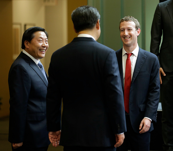 Chinese President Xi Jinping talks with Facebook founder Mark Zuckerberg as China's Internet czar Lu Wei looks on in this Sept. 23 2015