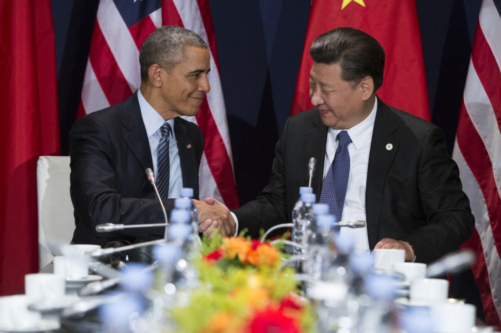 U.S. President Barack Obama left shakes hands with Chinese President Xi Jinping during their meeting held on the sidelines of the COP21 United Nations Climate Change Conference in Le Bourget outside Paris Monday Nov. 30 2015