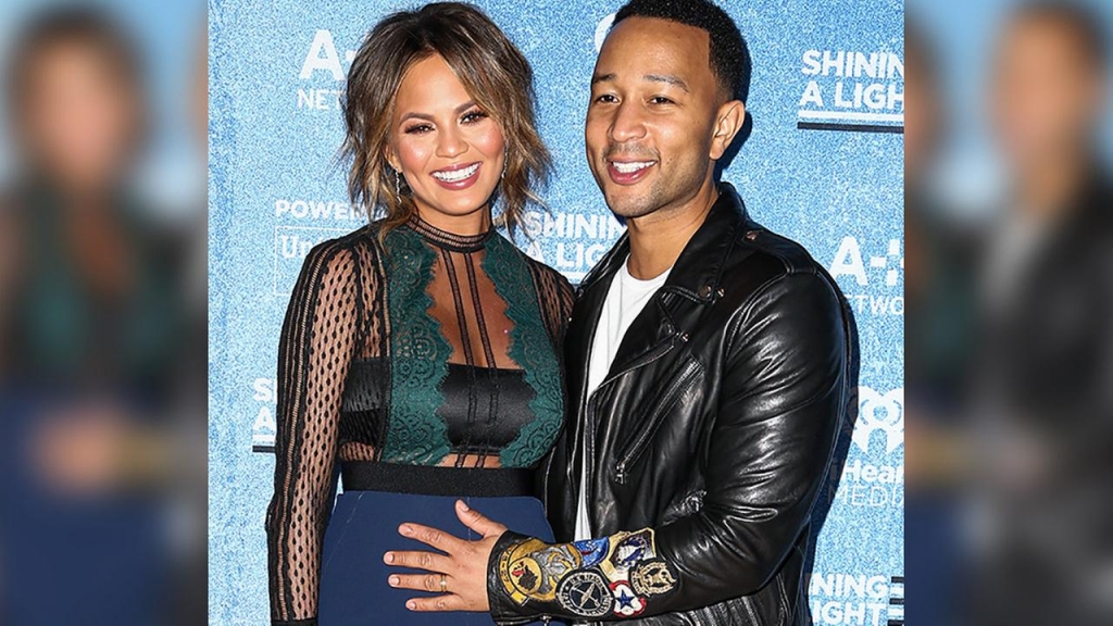 Chrissy Teigen left and John Legend pose backstage at the Shining a Light A Concert for Progress on Race in America held at the Shrine Auditorium on Wednesday Nov. 18 2015