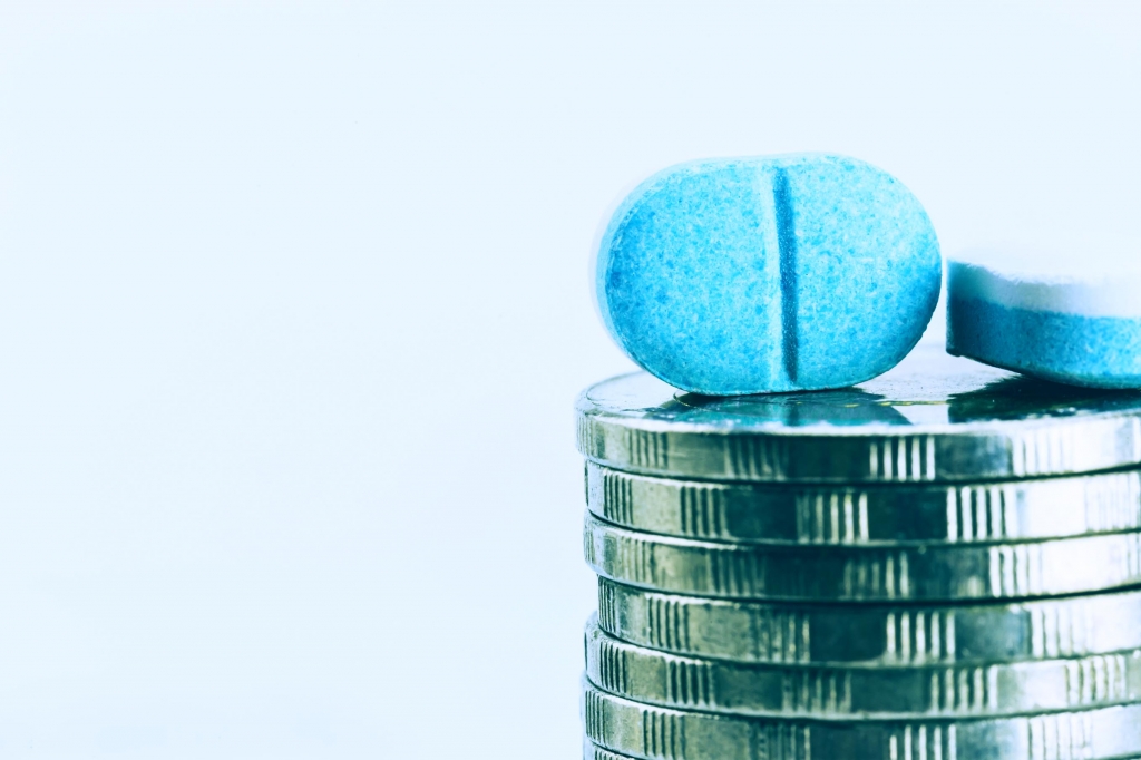 Close up Medicine pills and coin stack