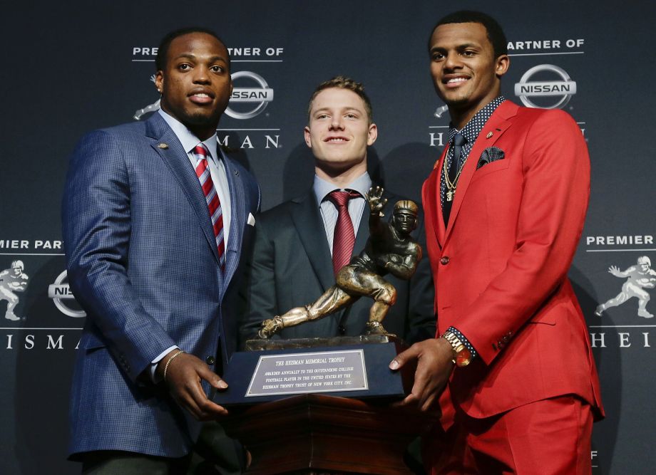 Heisman Trophy winner Derrick Henry poses with fellow finalists Christian Mc Caffrey of Stanford and Clemson’s Deshaun Watson