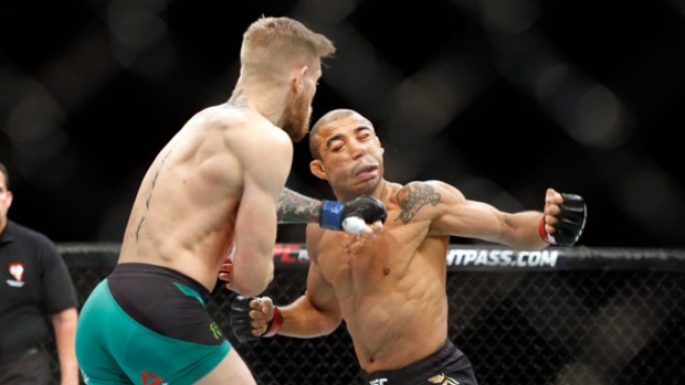 Conor Mc Gregor knocks out Jose Aldo during a featherweight championship bout at UFC 194 Saturday