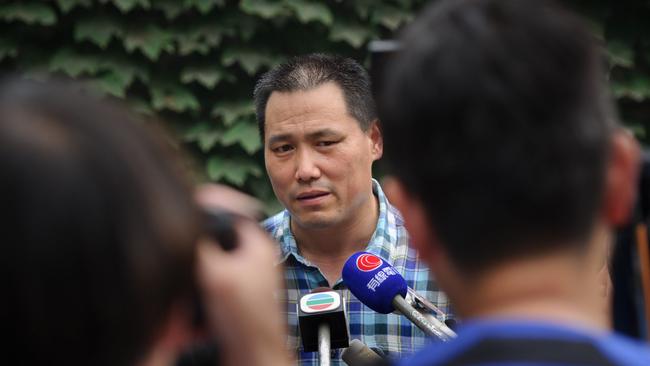 Chinese human rights lawyer Pu Zhiqiang stands trial as supporters rally outside Beijing courthouse