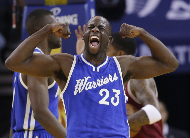 Golden State Warriors Draymond Green celebrates after scoring against the Cleveland Cavaliers during the first half of an NBA basketball game Friday D