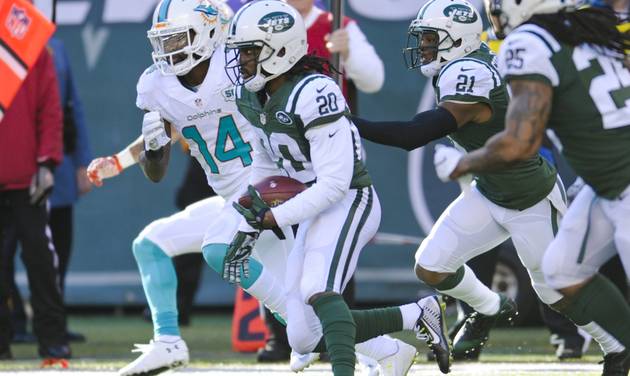 Jets strong safety Marcus Williams runs back an interception past Miami Dolphins Jarvis Landry during the first half of an NFL football game Sunday Nov. 29 2015 in East Rutherford N.J