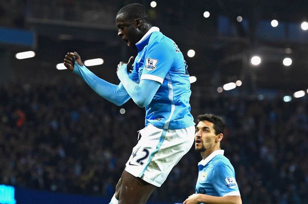 Yaya Toure celebrates scoring City's second goal from the penalty spot