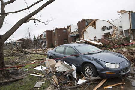 NATURE’S FURY A destroyed apartment complex is seen on December 28 in the aftermath of a tornado in Garland Texas. The southern US state of Texas reeled from rare December tornados as days of storms battering a vast region stretching from the southwe