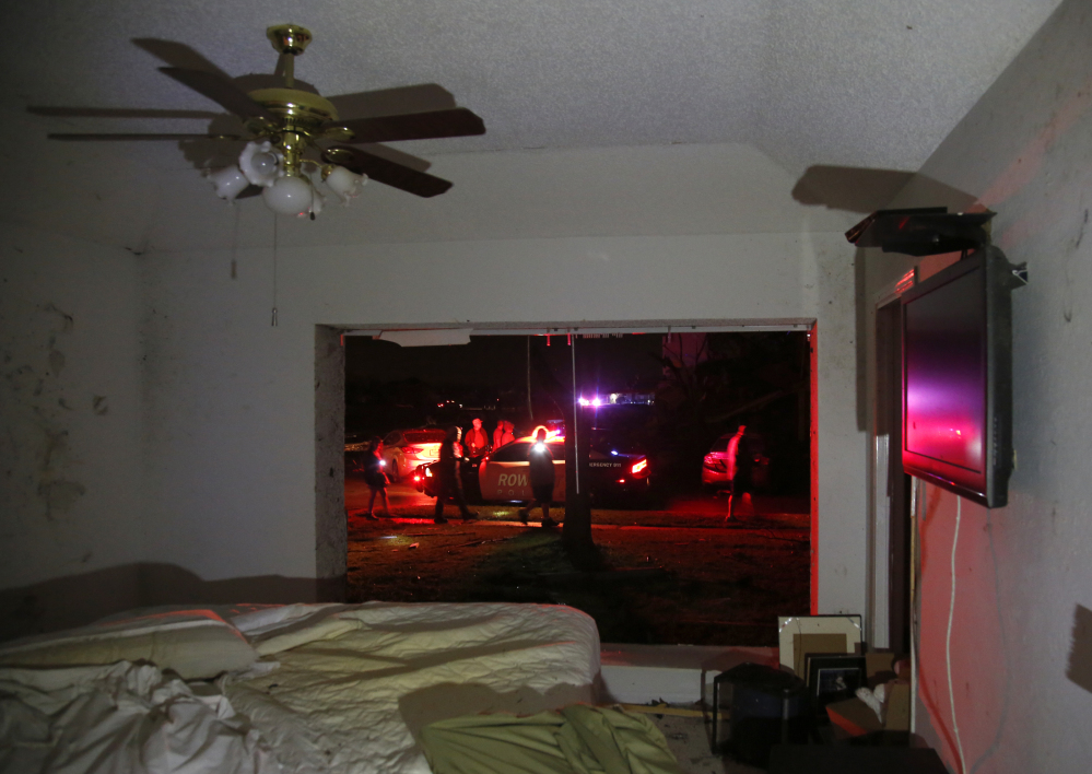 The Associated Press Rowlett first responders work in the street across from Daniel O’Connor’s heavily damaged home after reports of a tornado in Rowlett Texas on Saturday. The large window in O’Connor’s bedroom was completely ripped out and deb