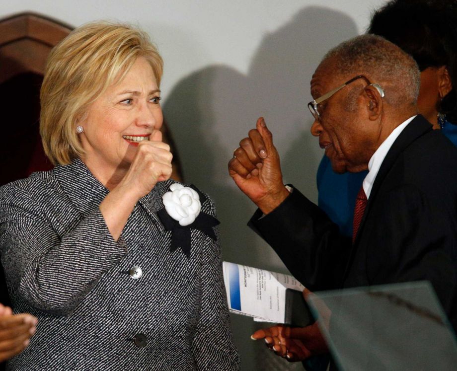 Democratic presidential candidate Hillary Clinton greets and gives a thumbs-up to Fred Gray Rosa Parks former attorney before speaking at the Dexter Avenue King Memorial Baptist Church Tuesday Dec. 1 2015 in Montgomery Ala. Mrs. Clinton's keynote