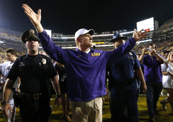 LSU head coach Les Miles celebrates after