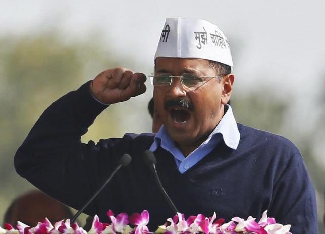 Arvind Kejriwal chief of Aam Aadmi Party, addresses his supporters after taking the oath as the new chief minister of Delhi during a swearing-in ceremony at Ramlila ground in New Delhi