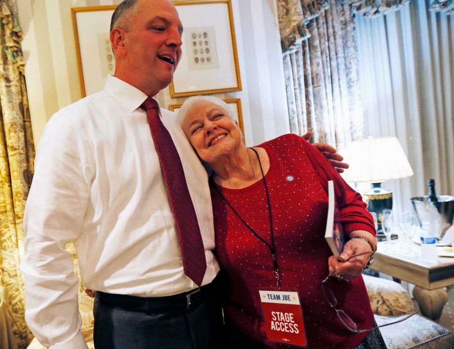 Louisiana Democratic gubernatorial candidate Rep. John Bel Edwards hugs his mother Dora Jean Edwards as he watches election returns in a hotel suite at his election night watch party in New Orleans Saturday Nov. 21 2015. ORG X