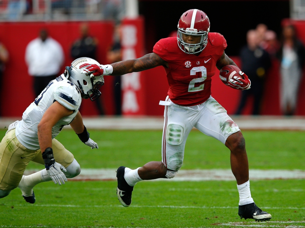 Derrick Henry #2 of the Alabama Crimson Tide breaks a tackle by Zane Cruz #43 of the Charleston Southern Buccaneers at Bryant Denny Stadium