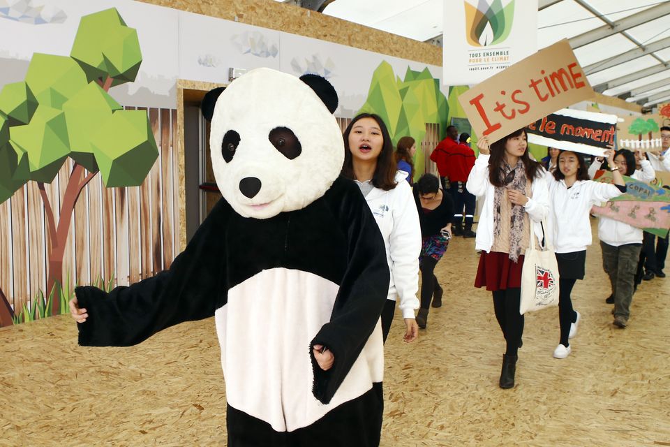 The Latest New draft emerges at Paris climate talks