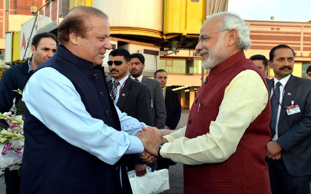 Prime Minister of Pakistan Nawaz Sharif shakes hands with Indian Prime Minister Narendra Modi at Allama Iqbal International Airport in Lahore Pakistan