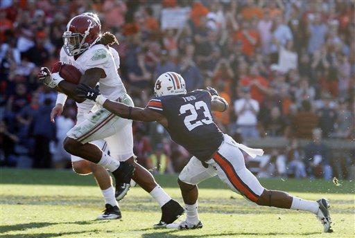 Alabama running back Derrick Henry runs the ball during an NCAA college football game against Alabama Saturday Nov. 28 2015 in Auburn