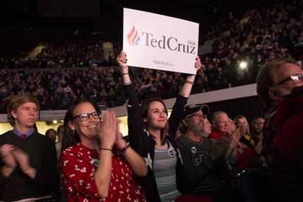 Traci Jackson of Louisville Neb. left and Emily Jackson 24 of Gretna Neb. applaud as Republican presidential candidate Sen. Ted Cruz R-Texas speaks during the Rising Tide Summit at the US Cellular Center in Cedar Rapids Iowa