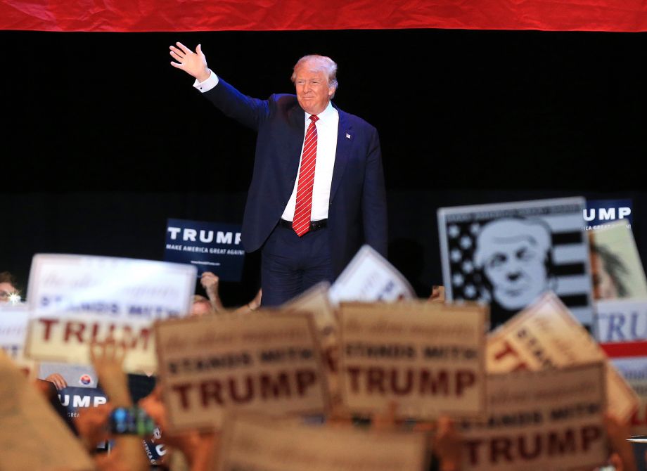 Donald Trump takes the stage making his second campaign visit to Georgia at the Macon Centreplex Coliseum on Monday Nov. 30 2015 in Macon