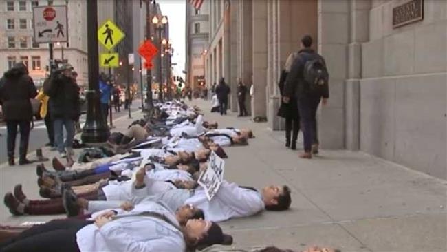 Dozens of medical students in Chicago have staged a'die-in protest to remember Laquan McDonald's shooting death by police