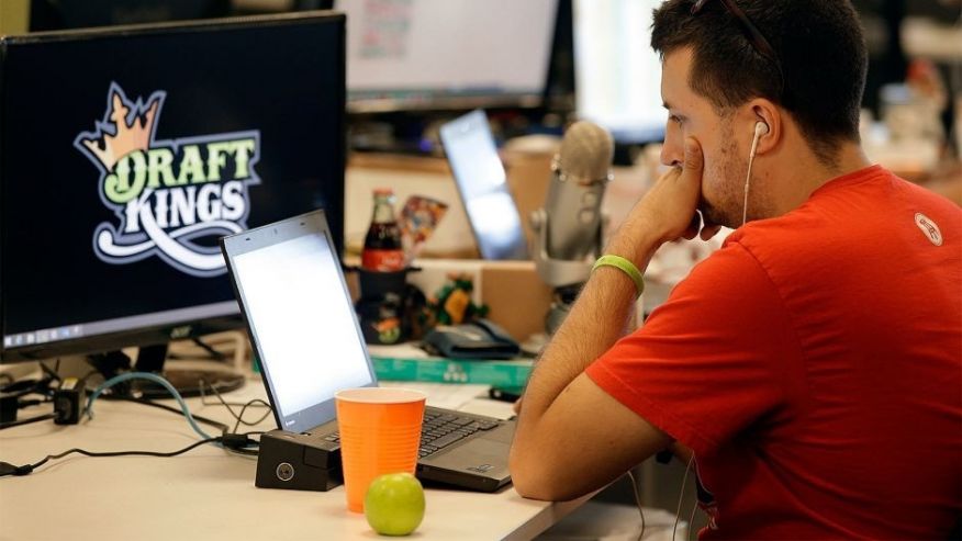 Devlin D'Zmura a tending news manager at DraftKings a daily fantasy sports company works on his laptop at the company's offices in Boston. Nevada has already decided daily fantasy sports are gambling