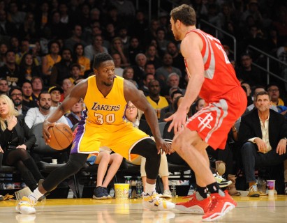 Los Angeles CA USA Los Angeles Lakers forward Julius Randle moves the ball against Houston Rockets forward Donatas Motiejunas during the second half at Staples Center. Mandatory Credit Gary A. Vasquez-USA TODAY Sports